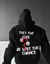 Black statement hoodies for men featuring a bold graphic saying 'Take the Risk or Lose the Chance'